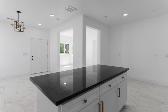 36950 Pauline Ave, Madera, CA 93636 - kitchen featuring light marble finish floors, recessed lighting, white cabinets, pendant lighting, and a center island