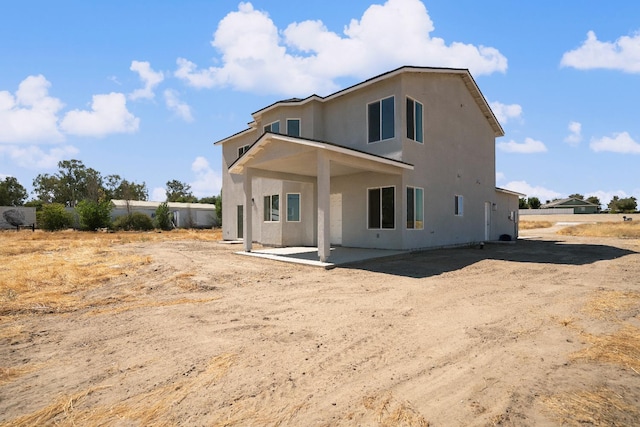 36950 Pauline Ave, Madera, CA 93636 - rear view of house featuring stucco siding and a patio