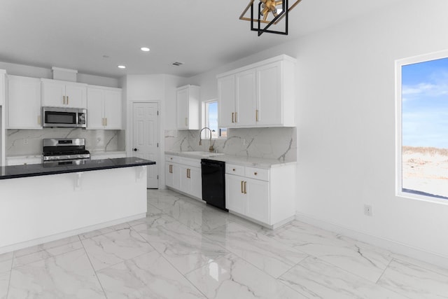 36950 Pauline Ave, Madera, CA 93636 - kitchen with appliances with stainless steel finishes, recessed lighting, light marble finish floors, and white cabinetry