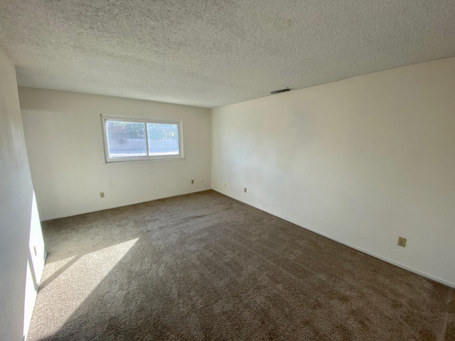 12173 Rd 36, Madera, CA 93636 - carpeted empty room with a textured ceiling
