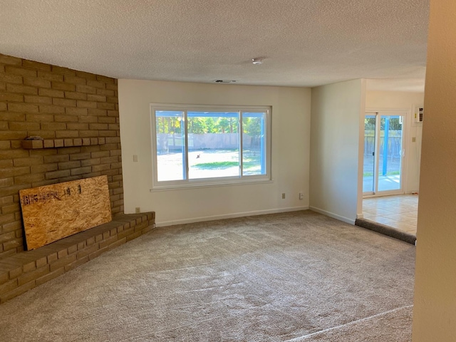 12173 Rd 36, Madera, CA 93636 - unfurnished living room featuring carpet floors and a textured ceiling