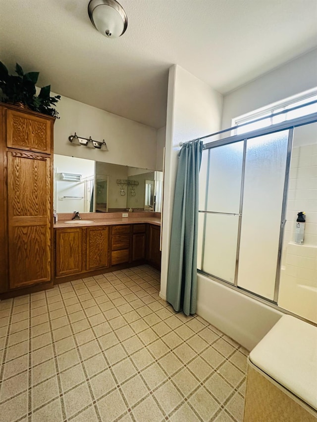 924 Palm Ave, Fowler, CA 93625 - bathroom with shower / bath combination with glass door, tile patterned floors, and double vanity