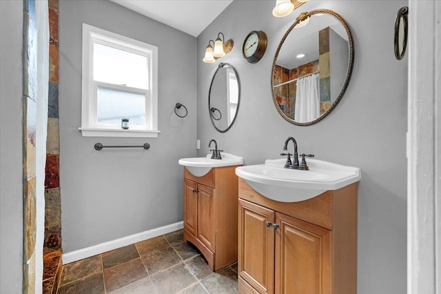 1440 E Fountain Way, Fresno, CA 93704 - full bath with two vanities, stone finish floors, and a shower with curtain