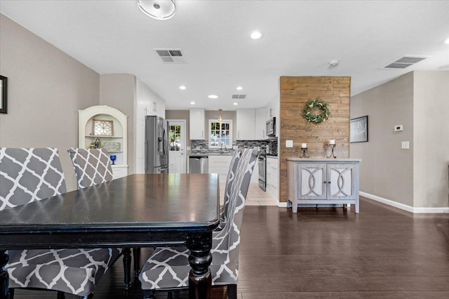 1440 E Fountain Way, Fresno, CA 93704 - dining space with dark wood finished floors and recessed lighting