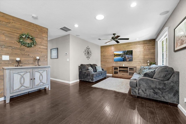 1440 E Fountain Way, Fresno, CA 93704 - living room featuring wooden walls, a ceiling fan, dark wood-style flooring, recessed lighting, and an accent wall
