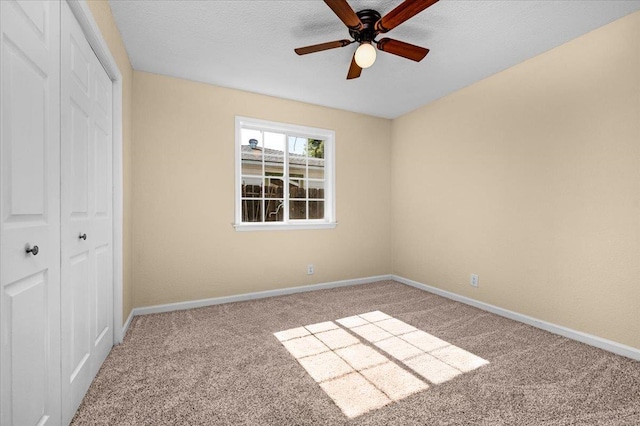 1440 E Fountain Way, Fresno, CA 93704 - unfurnished bedroom featuring a closet, carpet, and a ceiling fan