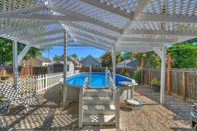 1440 E Fountain Way, Fresno, CA 93704 - view of swimming pool with a pergola, a fenced backyard, and a shed