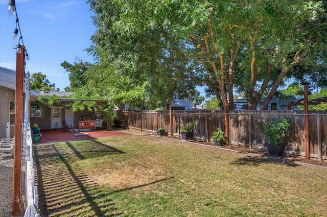 1440 E Fountain Way, Fresno, CA 93704 - fenced backyard featuring a patio