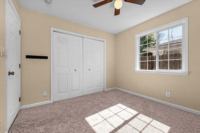 1440 E Fountain Way, Fresno, CA 93704 - unfurnished bedroom with carpet floors, a closet, and a ceiling fan