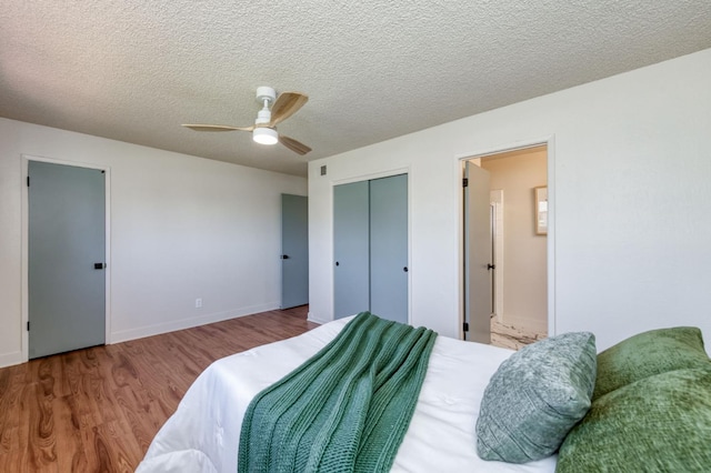1648 Purvis Ave, Clovis, CA 93611 - bedroom with wood finished floors, a textured ceiling, ensuite bath, and a ceiling fan