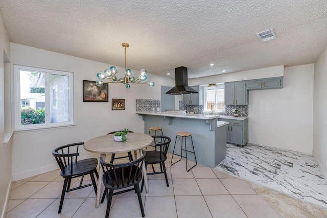 1648 Purvis Ave, Clovis, CA 93611 - dining space featuring a textured ceiling, recessed lighting, and a chandelier