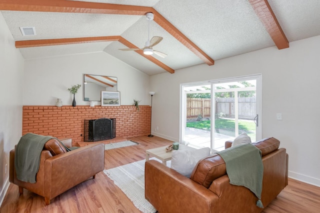 1648 Purvis Ave, Clovis, CA 93611 - living area featuring wood finished floors, ceiling fan, and a brick fireplace