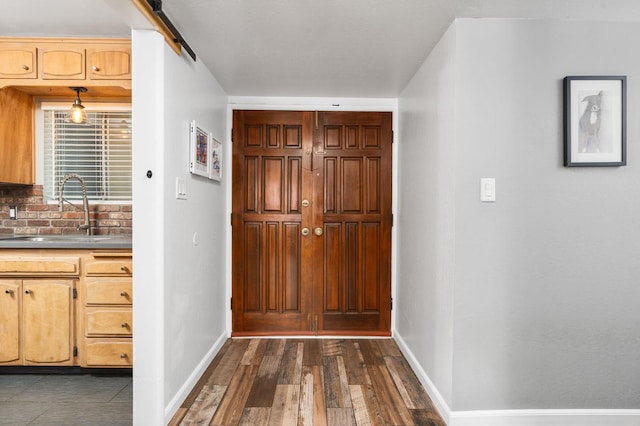 2344 E Menlo Ave, Fresno, CA 93710 - foyer entrance with dark wood-type flooring and a barn door