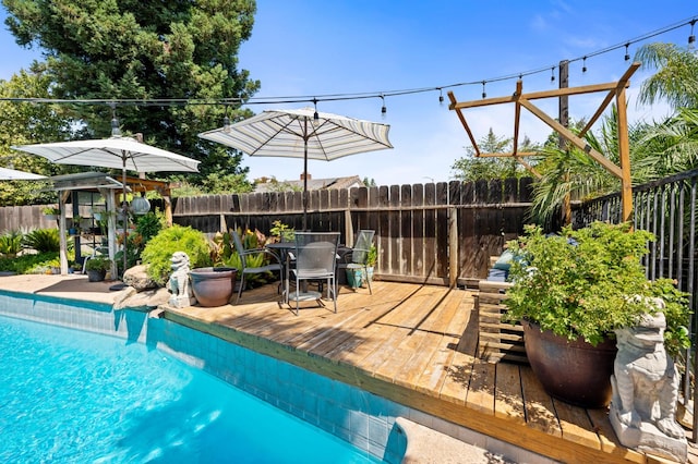 2344 E Menlo Ave, Fresno, CA 93710 - view of pool featuring outdoor dining area and a wooden deck