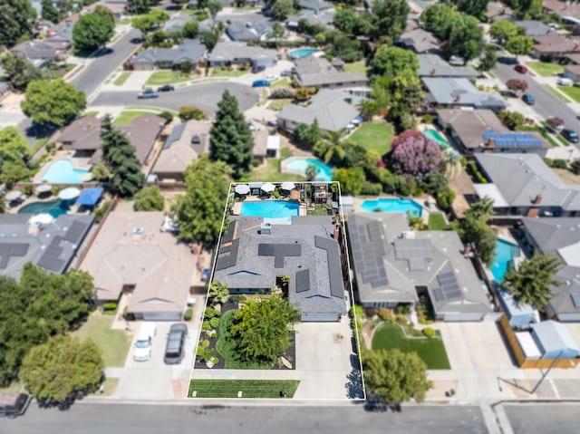 2344 E Menlo Ave, Fresno, CA 93710 - aerial perspective of suburban area with a pool and property parcel outlined