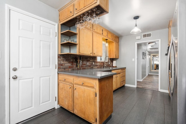 2344 E Menlo Ave, Fresno, CA 93710 - kitchen with freestanding refrigerator, a peninsula, decorative backsplash, open shelves, and hanging light fixtures