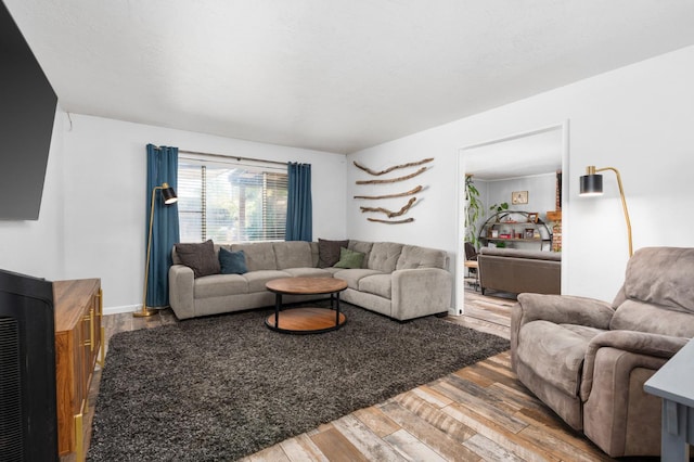 2344 E Menlo Ave, Fresno, CA 93710 - living room featuring wood finished floors