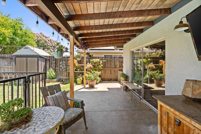 2344 E Menlo Ave, Fresno, CA 93710 - fenced backyard with a patio area and a storage unit