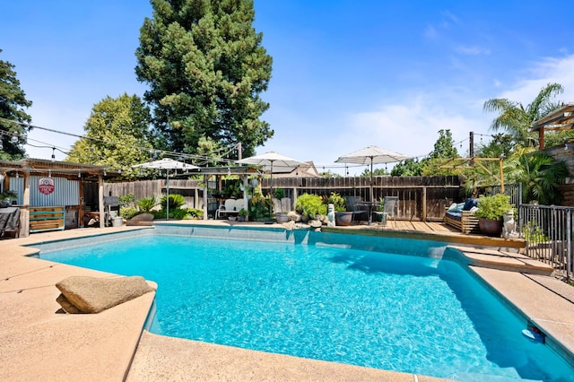 2344 E Menlo Ave, Fresno, CA 93710 - view of swimming pool featuring a fenced backyard and a deck