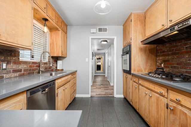 2344 E Menlo Ave, Fresno, CA 93710 - kitchen featuring stainless steel appliances, under cabinet range hood, and tasteful backsplash