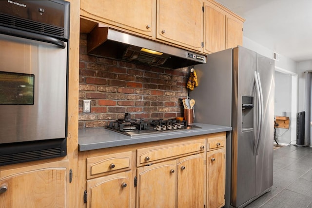 2344 E Menlo Ave, Fresno, CA 93710 - kitchen with under cabinet range hood, appliances with stainless steel finishes, and light brown cabinets