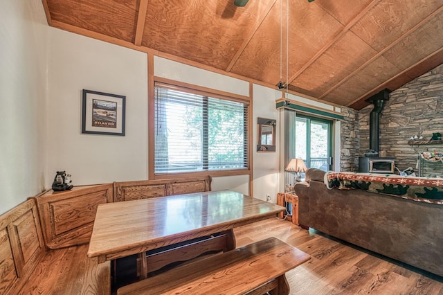 40904 Mill Run Ln Unit 60, Shaver Lake, CA 93664 - dining area with a wood stove, wooden ceiling, wood finished floors, vaulted ceiling, and ceiling fan