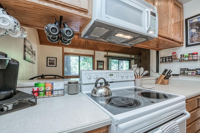 40904 Mill Run Ln Unit 60, Shaver Lake, CA 93664 - kitchen featuring white appliances, light countertops, and brown cabinets