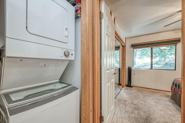 40904 Mill Run Ln Unit 60, Shaver Lake, CA 93664 - laundry room featuring stacked washing machine and dryer and light colored carpet