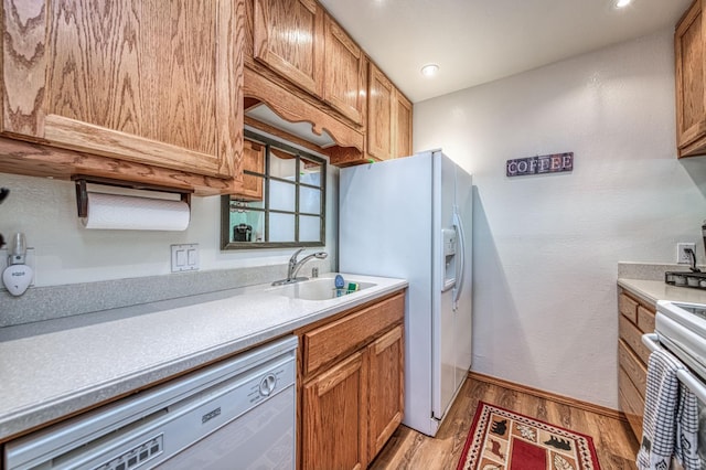 40904 Mill Run Ln Unit 60, Shaver Lake, CA 93664 - kitchen featuring white appliances, light wood-style floors, light countertops, and recessed lighting