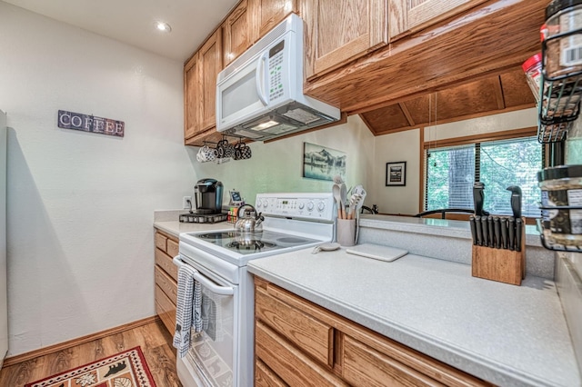 40904 Mill Run Ln Unit 60, Shaver Lake, CA 93664 - kitchen with white appliances, light wood-type flooring, light countertops, and brown cabinets