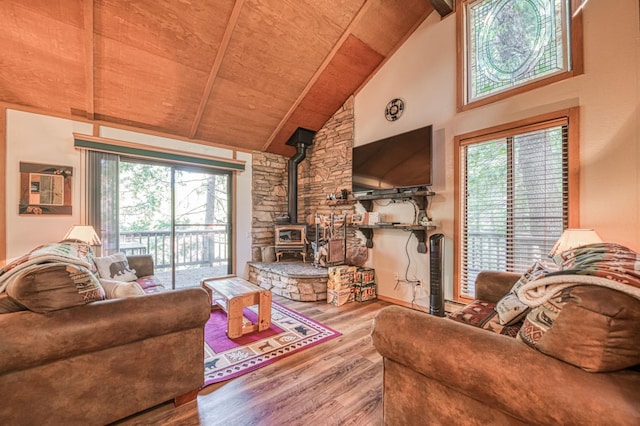 40904 Mill Run Ln Unit 60, Shaver Lake, CA 93664 - living area featuring a wood stove, healthy amount of natural light, wood finished floors, a wood ceiling with exposed beams, and high vaulted ceiling