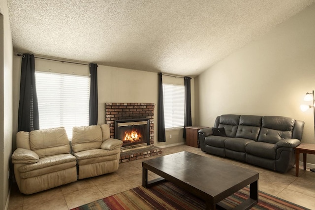 5051 E Lewis Ave, Fresno, CA 93727 - living room with light tile patterned floors, a textured ceiling, and a fireplace