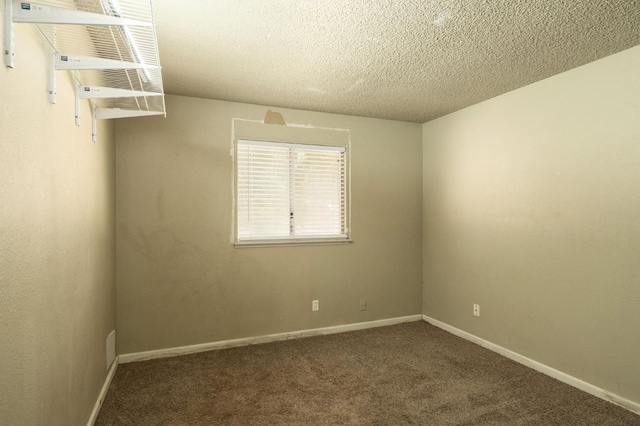 5051 E Lewis Ave, Fresno, CA 93727 - unfurnished room featuring carpet and a textured ceiling