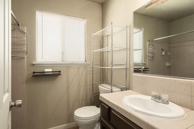 5051 E Lewis Ave, Fresno, CA 93727 - full bath featuring vanity, a shower, and tasteful backsplash