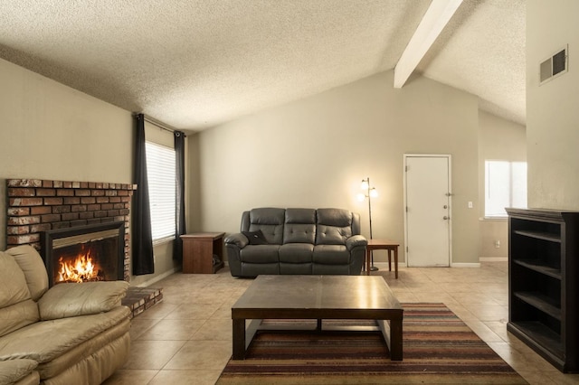 5051 E Lewis Ave, Fresno, CA 93727 - living room featuring a brick fireplace, a textured ceiling, and tile patterned floors
