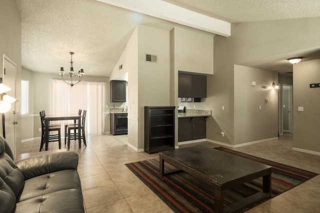 5051 E Lewis Ave, Fresno, CA 93727 - living area featuring a textured ceiling, a chandelier, light tile patterned flooring, high vaulted ceiling, and beam ceiling