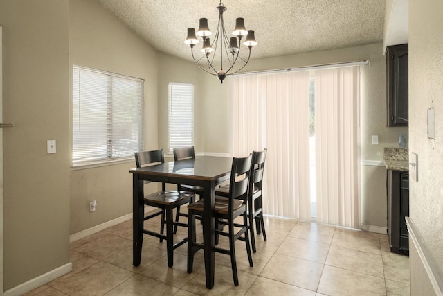 5051 E Lewis Ave, Fresno, CA 93727 - dining room with a chandelier, a textured ceiling, light tile patterned floors, and vaulted ceiling