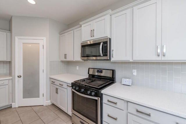 7393 E Michigan Ave, Fresno, CA 93737 - kitchen with appliances with stainless steel finishes, light countertops, backsplash, and recessed lighting