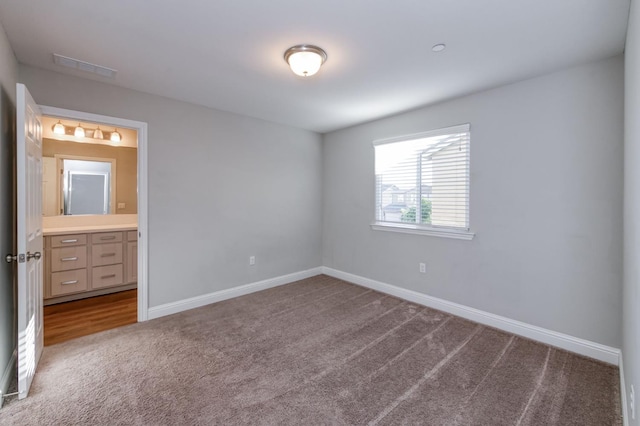 7393 E Michigan Ave, Fresno, CA 93737 - unfurnished bedroom with carpet floors and connected bathroom