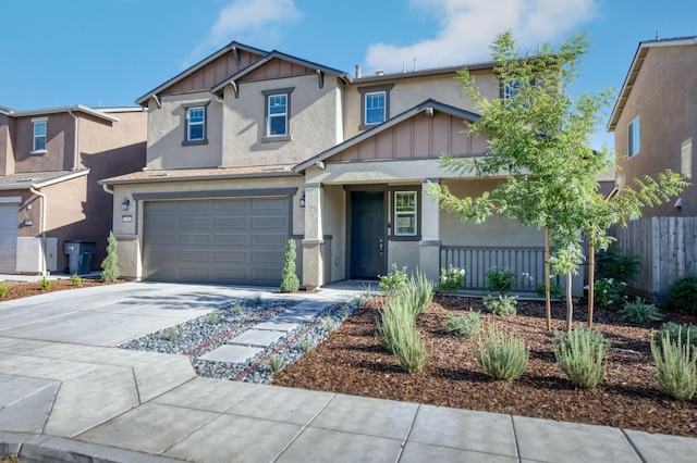 7393 E Michigan Ave, Fresno, CA 93737 - craftsman-style home with board and batten siding, a porch, stucco siding, and concrete driveway
