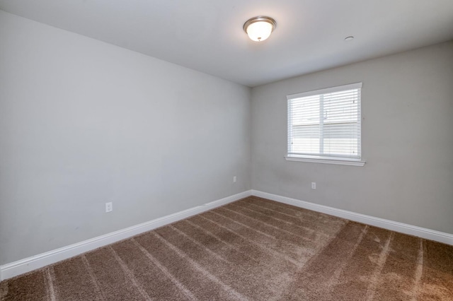 7393 E Michigan Ave, Fresno, CA 93737 - spare room with dark carpet and baseboards