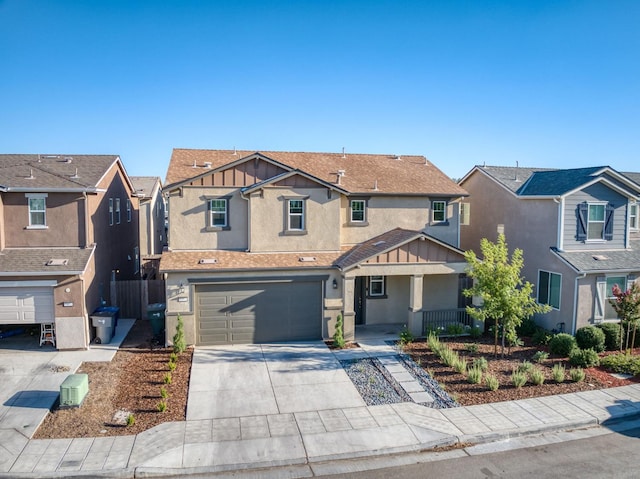 7393 E Michigan Ave, Fresno, CA 93737 - view of front of property featuring stucco siding, concrete driveway, a residential view, and covered porch