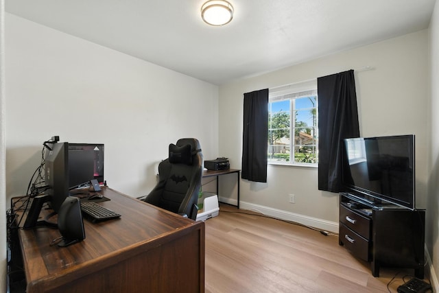 6431 E Inyo St, Fresno, CA 93727 - home office with light wood-style flooring and baseboards
