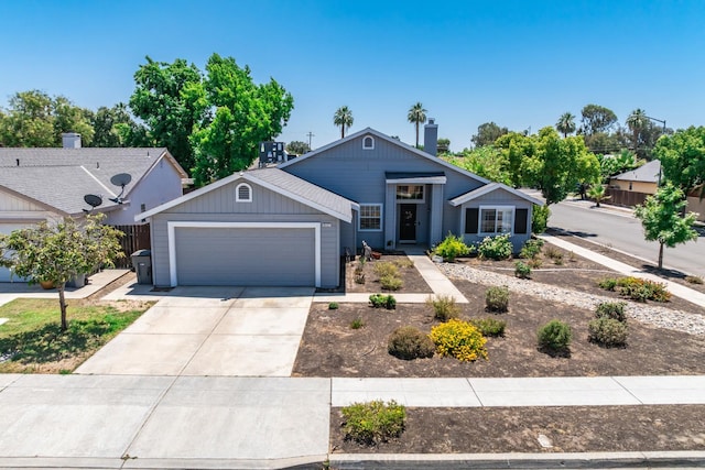 6431 E Inyo St, Fresno, CA 93727 - ranch-style house featuring an attached garage, driveway, and a chimney