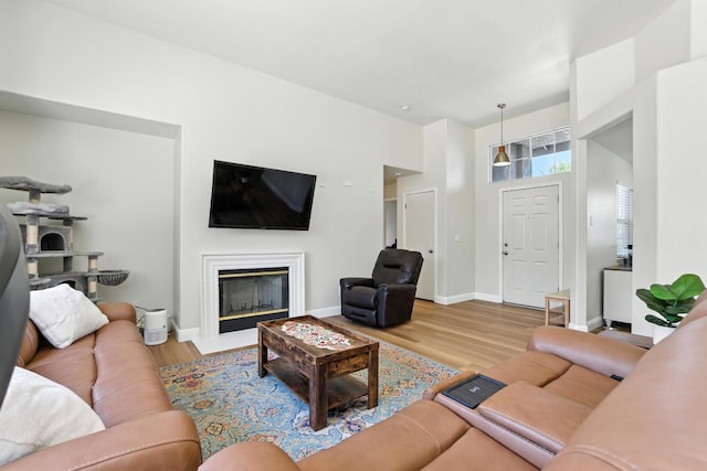 6431 E Inyo St, Fresno, CA 93727 - living area featuring wood finished floors and a fireplace with flush hearth