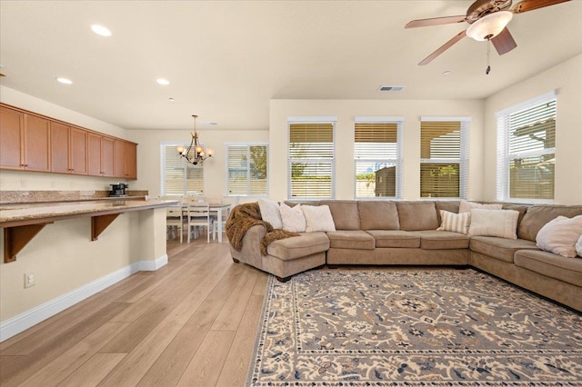 2481 S Via Versilia Dr, Fresno, CA 93727 - living area with a chandelier, light wood finished floors, recessed lighting, and ceiling fan