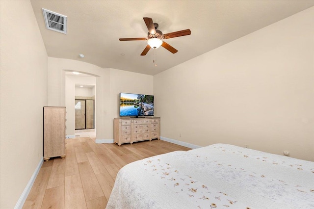 2481 S Via Versilia Dr, Fresno, CA 93727 - bedroom with light wood-type flooring, arched walkways, and ceiling fan