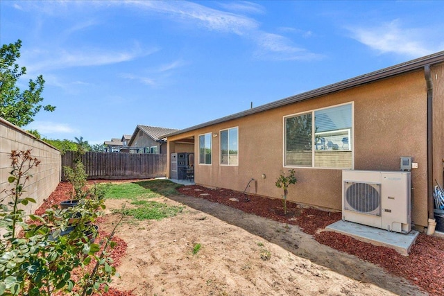 2481 S Via Versilia Dr, Fresno, CA 93727 - view of property exterior with a fenced backyard and stucco siding