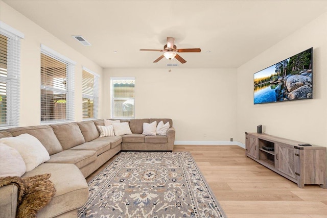 2481 S Via Versilia Dr, Fresno, CA 93727 - living room featuring light wood finished floors and ceiling fan