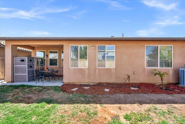 2481 S Via Versilia Dr, Fresno, CA 93727 - rear view of property featuring a patio area and stucco siding